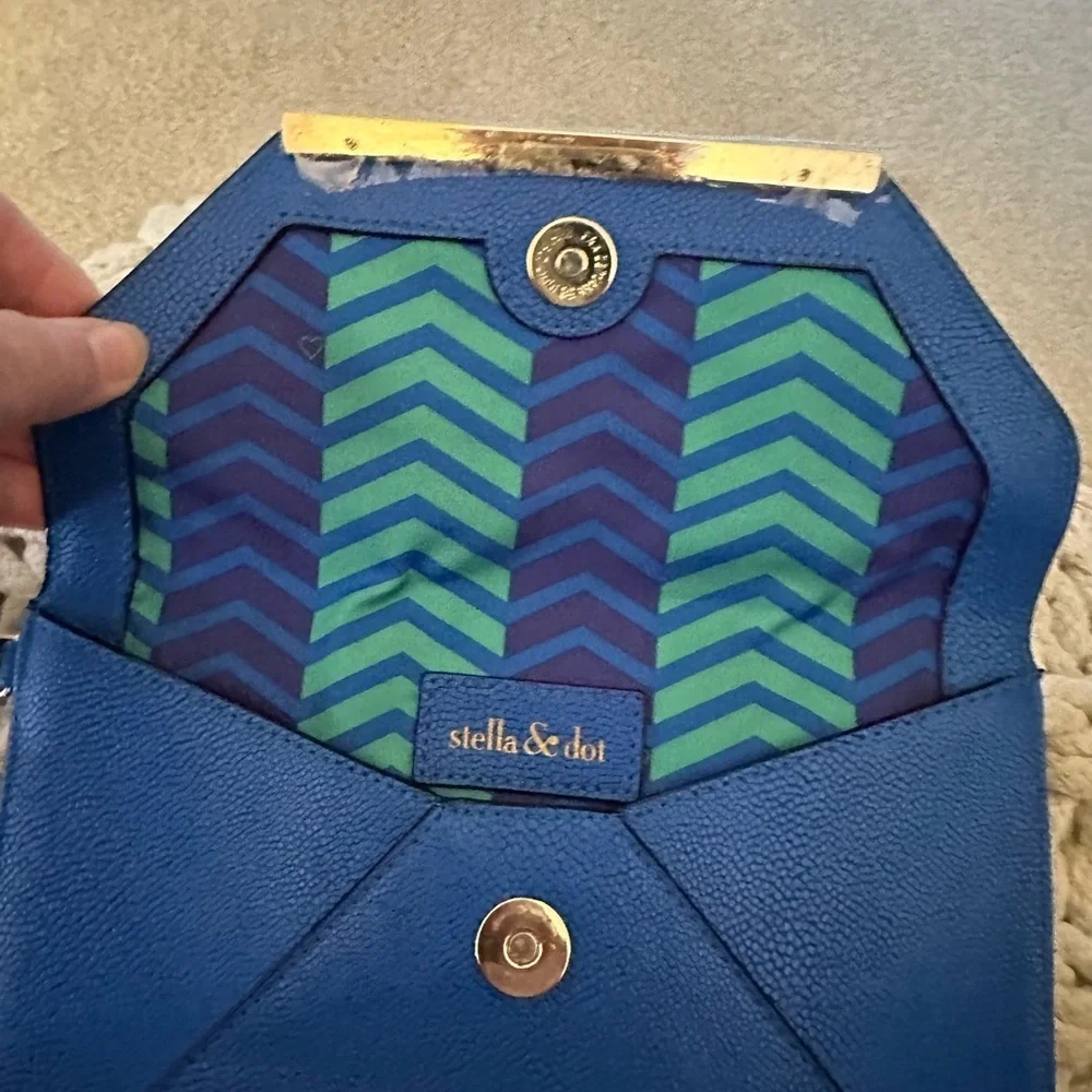 Stella and Dot wristlet never used. Great sailor blue color with gold accent